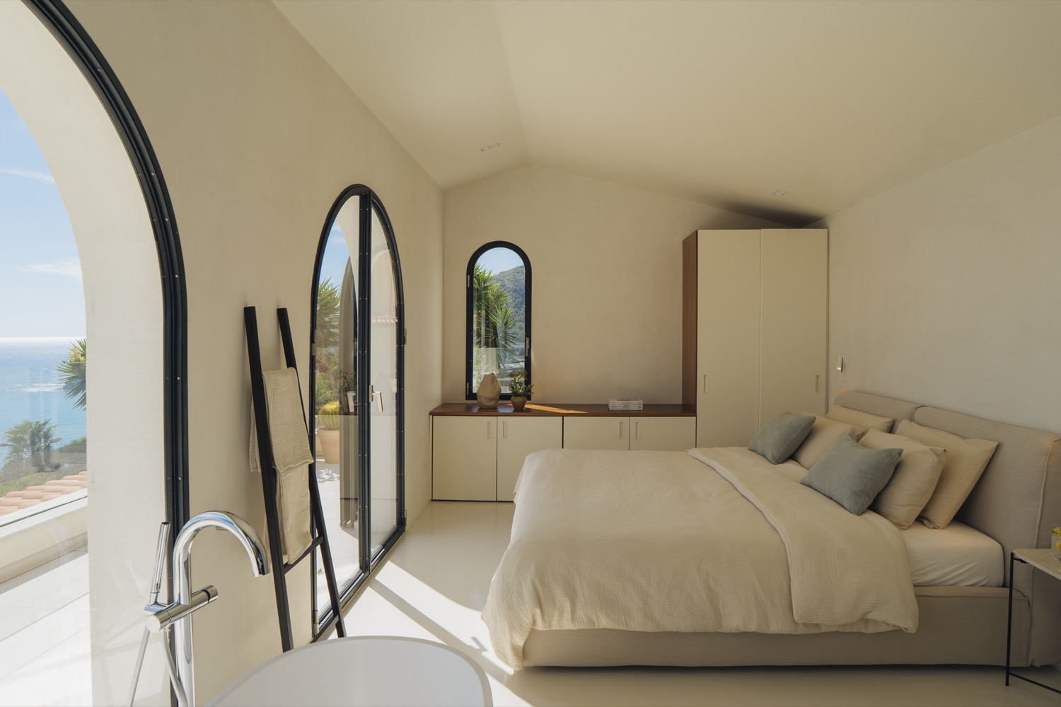 Master suite with freestanding tub and panoramic sea views